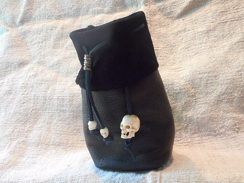skin dice bag with bone skull beads